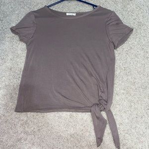 Super cute top with a tie at the bottom!